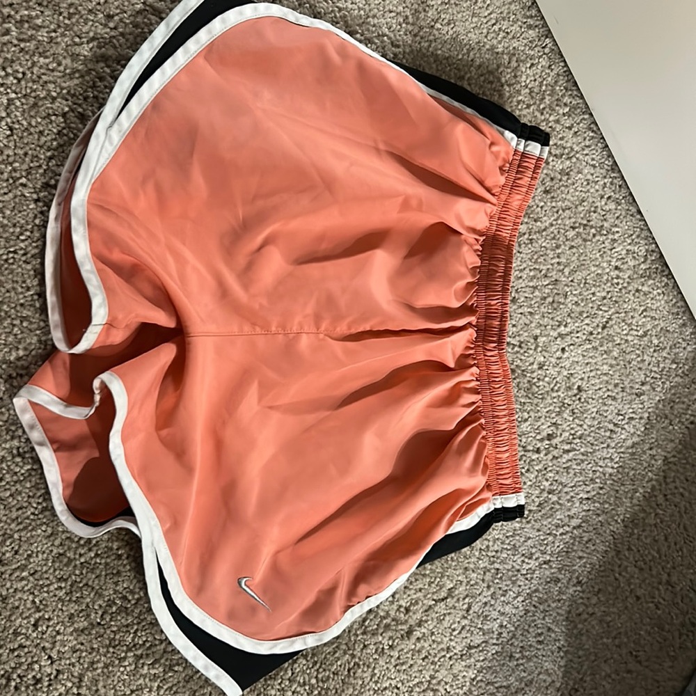 Nike Womens tempo brief-lined running shorts in pink, black and white.